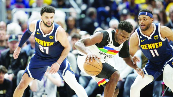 sports_NBA_resized Jamal Murray gets the last laugh in his shootout against Anthony Edwards. AP