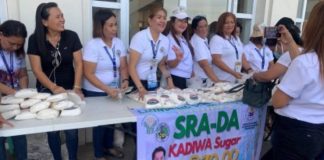 Personnel of the Bacolod City Cooperative and Livelihood Development Office sell Kadiwa sugar supplied by Victorias Milling Company at P70 per kilo during the launching of the program at the Government Center on Monday, April 3. BACOLOD CITY PIO PHOTO VIA PNA
