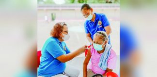 A senior citizen gets her dose of anti-COVID-19 vaccine at the municipal health center of Dueñas, Iloilo. DUEÑAS MUNICIPAL HEALTH OFFICE FB PHOTO