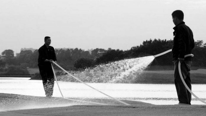 water Men water a golf course. According to the United Nations, water scarcity is becoming endemic because of overconsumption and pollution, while global warming will increase seasonal water shortages in both areas with abundant water and those already strained. GETTY IMAGES