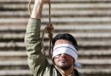 ‘Iran executions surged in 2022 to ‘spread fear’ A man protests in Lisbon, Portugal against Iran’s execution in December 2022 of two men over the anti-government protests. EPA