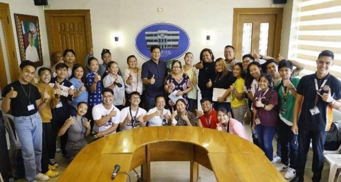 The Capiz State University Main Chorale together with Roxas City's Mayor Ronnie Dadivas. The group will compete in the 12th World Choir Games in South Korea in July.