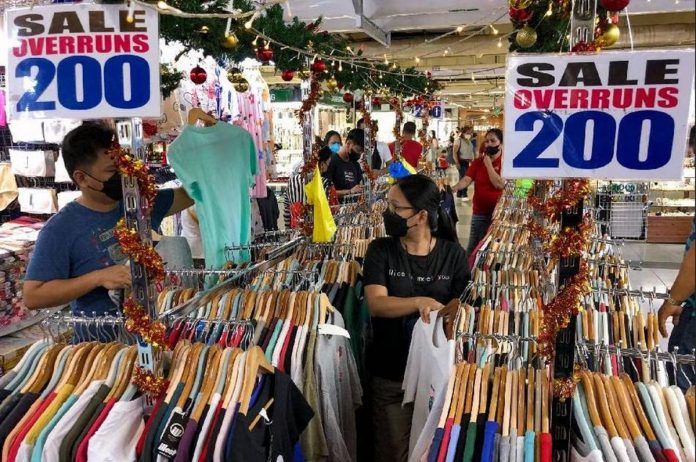 Flexi-shopping.JPG_resized Shoppers sift through overrun clothes for sale inside the Greenhills Shopping Center in San Juan. GEORGE CALVELO, ABS-CBN NEWS/FILE PHOTO