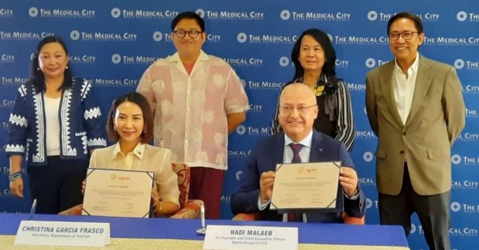 PH_-_Middle_East_resized Department of Tourism (DOT) Secretary Cristina Frasco (left, seated) and Agora co-founder and chief executive officer (CEO) Hadi Malaeb sign the title sponsorship agreement for the International Health and Wellness Tourism Congress at The Medical City in Pasig on Friday, May 5. Joining them are (from left, standing) DOT officials OIC-Undersecretary for Tourism Development Verna Buensuceso, Office of Product and Market Development (OPMD) Director Paulo Benito Tugbang, Agora Group Philippines Representative Angel Ramos Bognot, and Medical City President and CEO Dr. Eugenio Jose Ramos. PHOTO BY JOYCE ROCAMORA PHOTO