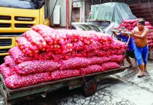 New SRP on onions takes effect Tuesday Porters push a cart loaded with onions in Binondo, Manila. The Department of Agriculture is targeting to implement and enforce the suggested retail price (SRP) on Tuesday, May 23. PNA PHOTO BY YANCY LIM