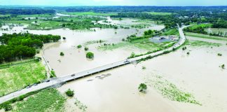 The Ulian Bridge in barangays Tinucoan and Capuling in Dueñas, Iloilo was submerged in floodwaters from Wednesday night, May 3, until Thursday morning, May 4. It became passable to vehicles by 12 noon on Thursday as seen in this photo. LGU DUEÑAS FACEBOOK PAGE PHOTO