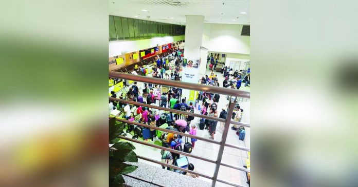 airport pic_superimposed The passenger terminal and departure area of the Iloilo Airport are now crowded and will be further overloaded once flight operations resume to pre-pandemic levels. PHOTO COURTESY OF JERRY TREÑAS FB PAGE