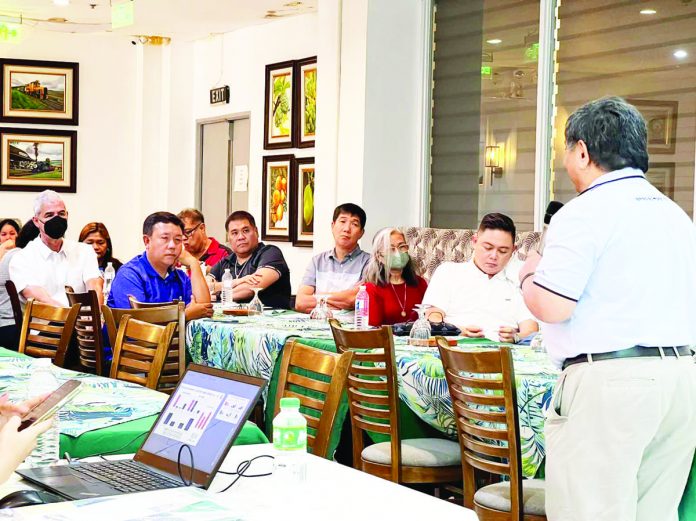dom_Ignite_(MORE)_front_pic_resized MORE Electric and Power Corporation (MORE Power) president and chief executive officer Roel Castro (right) presents to Negros Occidental officials the benefits that Negrenses could avail from the proposed joint venture agreement between Central Negros Electric Cooperative and Ignite Power, sister company of MORE Power.