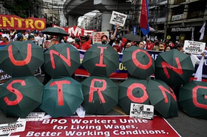 Demonstrators take part in a Labor Day rally in Mendiola, Manila on May 1, 2023. PHOTO BY JAM STA ROSA / AGENCE FRANCE-PRESSE