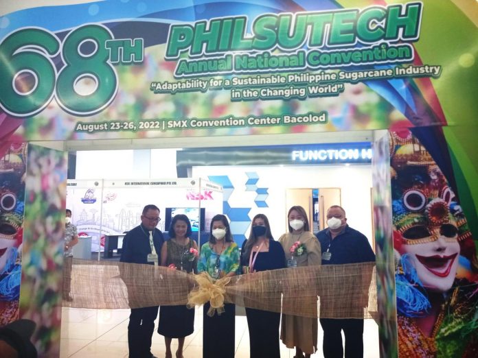 Engr. Noli Segovia (left), the plant manager of URC-SURE Distillery in La Carlota, was re-appointed as 69th Philsutech overall convention chairman. In this file photo, he is with (L-R) with his spouse Lyn, corporate secretary and administrative officer Haydee V. Rivera, Bacolod City’s Rep. Greg Gasataya’s chief of staff Franz Tionko, and Philsutech president Jose Ma. Valmayor and spouse Kristin Marie during the ribbon-cutting for the opening of the Philsutech product exhibit at SMX Convention Center in Bacolod City last year.