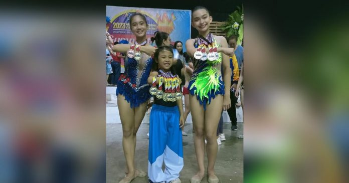 sports 3 tay_superimposed Bacolod Tay Tung High School gymnasts Jilian Krishna Dela Cruz, Reaiah Patricia Tan and Matthea Given Efenio display their 2023 WVRAA Meet medals. PHOTO COURTESY OF JOSE MONTALBO