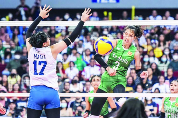 sports_DLSU_resized De La Salle University Lady Spikers’ Thea Gagate smashes the ball towards the defense of National University Lady Bulldogs’ Chams Maaya. UAAP PHOTO