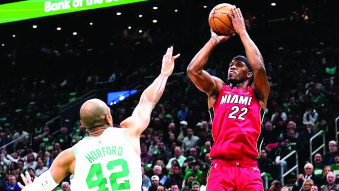 sports_NBA_resized Miami Heat’s Jimmy Bulter takes control of the ball as the Heat defeats Boston Celtics in Game One of the Eastern Conference finals. AP