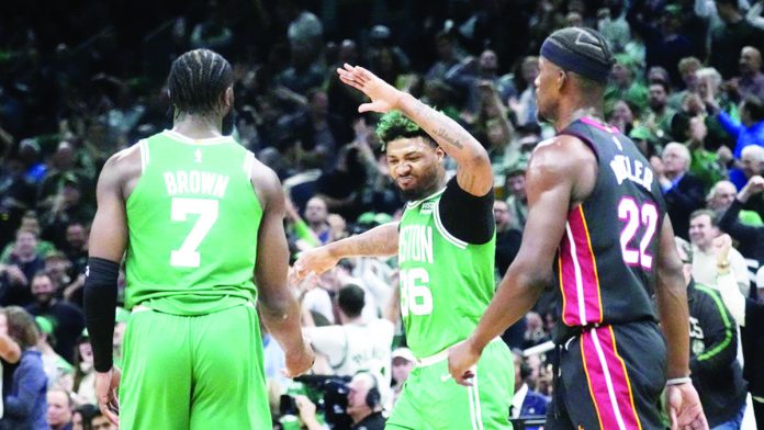 sports_NBA_resized Marcus Smart and Jaylen Brown of the Boston Celtics rejoice as their team extends the Eastern Conference finals to Game 5. AP