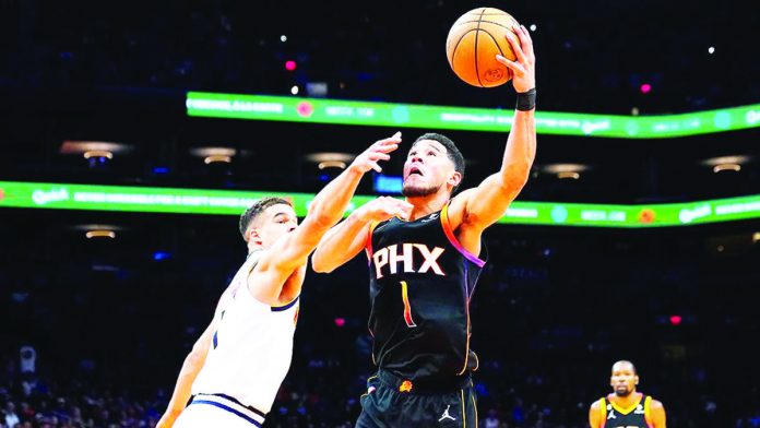 sports_NBA_resized Phoenix Sun s’ Devin Booker averages 36 points on 60 percent shooting in these playoffs. AP