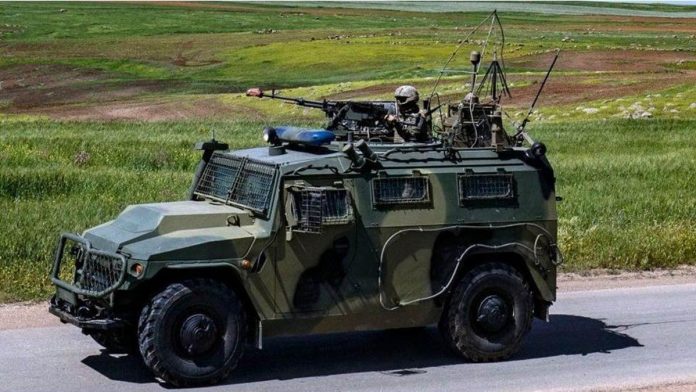 turkey_resized A soldier mans a machine gun mounted on an army vehicle during a Turkish and Russian military patrol in Syria. AFP