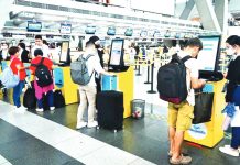 Domestic flight passengers check in at Cebu Pacific's on-site check-in lane at the Ninoy Aquino International Airport Terminal 3 in Pasay City. MARK DEMAYO/ABS-CBN NEWS PHOTO