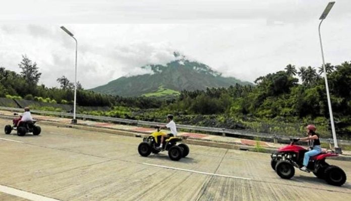 albay_resized The Philippine Institute of Volcanology and Seismology places Mayon Volcano under alert level 2 after its monitoring of the summit crater shows an increased rockfall. On Monday, several tourists are seen still enjoying all-terrain vehicle rides in Daraga, Albay, as clouds obscure the view of Mayon. Photo by MARK ALVIC ESPLANA / Inquirer Southern Luzon