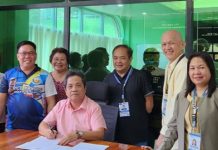 Photo shows SSS Butuan Branch Head Perkins B. Calixtro (standing, 3rd from right) and Tubay Mayor Jimmy L. Beray (seated), together with other LGU officials and SSS representatives during the ceremonial signing held at the Municipal Hall of Tubay on May 11.
