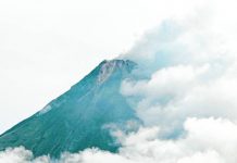 Mayon now on Alert Level 3; rockfalls increase – Phivolcs The summit of Mayon Volcano in Albay is partly covered with clouds in this photo taken on June 5, 2023. The Philippine Institute of Volcanolofgy and Seismology has raised Alert Level 3 Thursday morning due to increasing number of rockfalls. MARK ALVIC ESPLANA