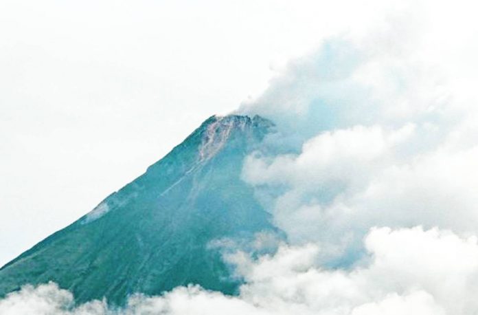 mayon The summit of Mayon Volcano in Albay is partly covered with clouds in this photo taken on June 5, 2023. The Philippine Institute of Volcanolofgy and Seismology has raised Alert Level 3 Thursday morning due to increasing number of rockfalls. MARK ALVIC ESPLANA