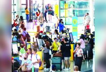 Travelers line up at airline counters to process their travel documents at the Ninoy Aquino International Airport Terminal 3 in Pasay City. JONATHAN CELLONA/ABS-CBN NEWS PHOTO