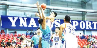 Ilonggo Clint Doliguez of the NLEX Road Warriors wards the defense of Antiqueño Tzaddy Rangel of Phoenix Super LPG Fuel Masters for a layup attempt. PBA PHOTO
