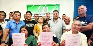 Central Negros Electric Cooperative president Jojit Yap and acting general manager Arnel Lapore and Primelectric Holdings president and chief executive officer Roel Castro sign a joint venture agreement on Saturday, June 3.