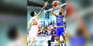 Magnolia Chicken Timplados Hotshots’ Jerrick Ahanmisi shoots over the defense of NorthPort Batang Pier’s Michael Salado. PBA PHOTO