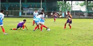 Members of Western Visayas elementary boys football team take control of the ball during their clash with the Region 9 football team at the Don Bosco Technological College in Cebu City.