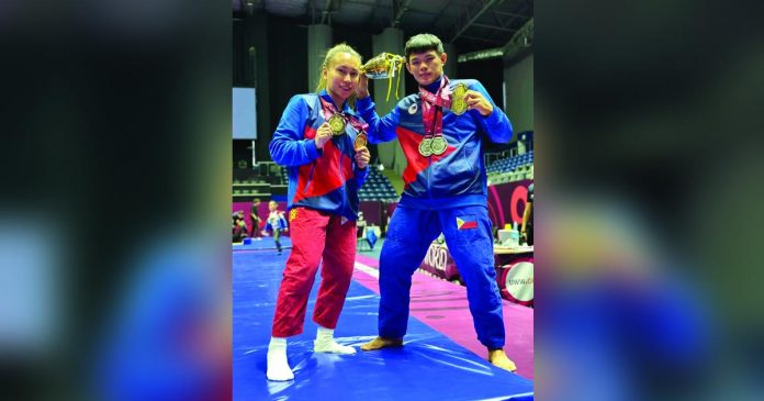 sports pinoy_superimposed Maria Aisa Ratcliff and Fierre Afan display the medals they won in the 2023 United World Wrestling United World Grappling Asian Championships. CONTRIBUTED PHOTO
