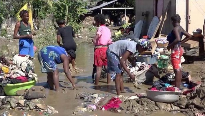 world_Haiti_resized Haitians wash their clothes in a river that turned murky due to recent floods. Then just the other day, they faced another disaster – an earthquake. BBC