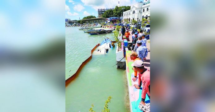 BFAR patrol_superimposed The sunken patrol boat of the Bureau of Fisheries and Aquatic Resources-6 was retrieved yesterday morning, July 4. AJ PALCULLO/PN