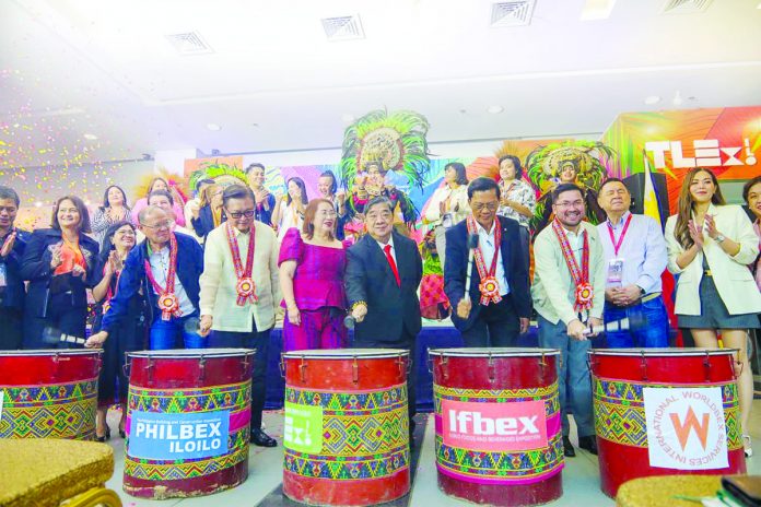 Distinguished guests beat the drums to mark the begginning of the expositions. Present were (from left) Department of Public Works and Highways assistant regional director Mr. Jose Al V. Fruto; Iloilo City MICE director Mr. Salvador D. Sarabia Jr.; Ms. Levi Ang; Worldbex Services International (WSI) chairperson Mr. Joseph L. Ang; Iloilo Provincial Engineer Engr. Romeo C. Andig; Executive Assistant to Iloilo City Vice Mayor Jeffrey Ganzon, Mr. Nene Dela Llana; and WSI director Mr. Rene Ramos. JADE DEQUINA/CMO