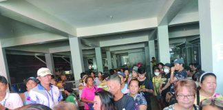 Vendors waited in line during the raffling of stalls last month at the Annex Building of Libertad Market in Bacolod City. A night market will accommodate those who were unable to secure stalls. MAE SINGUAY PHOTO