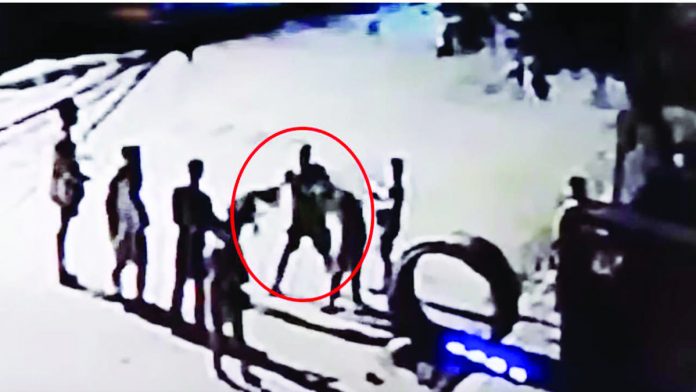 cop_resized A personnel of the Negros Occidental Police Provincial Office allegedly hurt two minors aged 12 and 13 in Barangay 30, Bacolod City. The photo is a screengrab from closed-circuit television footage of the incident on the evening of July 10. GENELOU NATIBO-OC FACEBOOK
