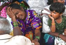 At least 22 dead, dozens trapped in India landslide Relatives of people who lost their lives in a landslide weep in a house at Irshalwadi village in Raigad district of India's Maharashtra state. GETTY IMAGES