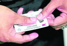 LICENSE CARDS. A staff of the Land Transportation Office shows a brand new student driver’s license at the Land Transportation Office Quezon City District Office in Centris Station. INQUIRER PHOTO/LYN RILLON