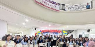Gov. Arthur Defensor Jr. and Iloilo Provincial Population Office acting head Atty. Ruel Von Superio lead the recognition of outstanding peer helpers at the provincial capitol on Monday, July 17. ILOILO PROVINCIAL POPULATION OFFICE PHOTO