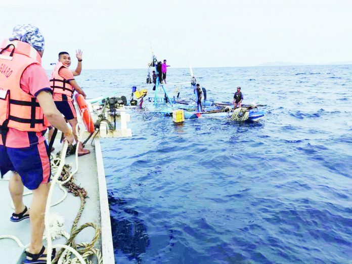 rescue_resized Seven crew members of a distressed fishing boat in the seawater between Masbate and Carles, Iloilo were rescued on Friday, July 28. PCG ILOILO STATION