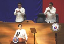 VITAL MEASURES. President Ferdinand “Bongbong” Marcos Jr. urged Congress to pass priority measures of his administration, during his first State of the Nation Address at the Batasang Pambansa Complex in Quezon City on July 25, 2022. Standing behind him are Senate President Juan Miguel Zubiri (left) and House Speaker Martin Romualdez. PNA PHOTO