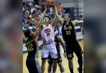 Barangay Ginebra San Miguel Kings’ Kim Aurin challenges the defense of TNT Tropang Giga’s Glenn Khobuntin and Dave Marcelo for an inside attempt. PBA PHOTO
