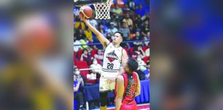 Blackwater Bossing’s Mike Ayonayon glides to the basket for a layup as Negrense Siverino Baclao of San Miguel Beermen looks on. PBA PHOTO