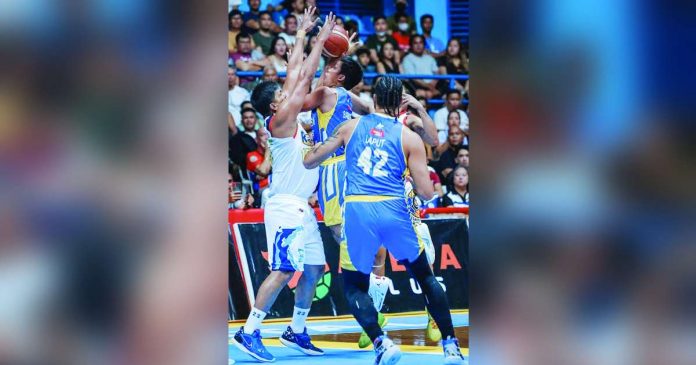 sports magnolia_superimposed Magnolia Chicken Timplados Hotshots’ Andy Mark Barroca had his shot blocked by the defense of Rain or Shine Elasto Painters’ Jewel Ponferrada. PBA PHOTO