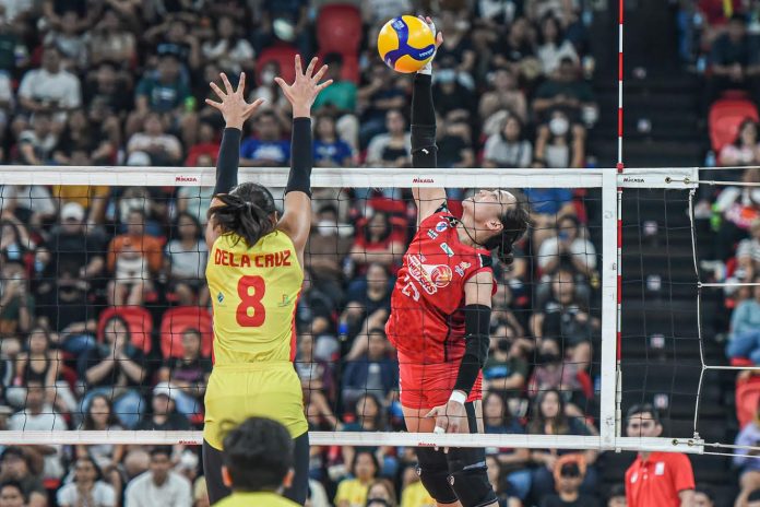 sports tubino PLDT High Speed Hitters’ Honey Royce Tubino scores against the defense of F2 Logistics Cargo Movers’ Jolina dela Cruz. PVL PHOTO