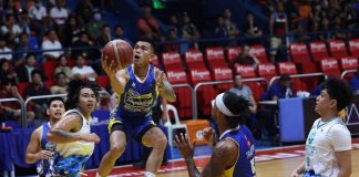 Magnolia Chicken Timplados Hotshots’ Jiovani Jalalon sits on the air as he goes for a layup.