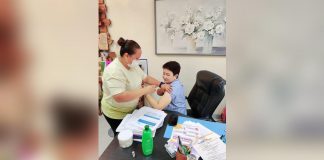 Dr. Maria Socorro Colmenares-Quiñon, head of the Iloilo Provincial Health Office (IPHO), receives her shot of the bivalent vaccine administered by an IPHO vaccinator on Friday, July 7. MARIA SOCORRO COLMENARES-QUIÑON PHOTO