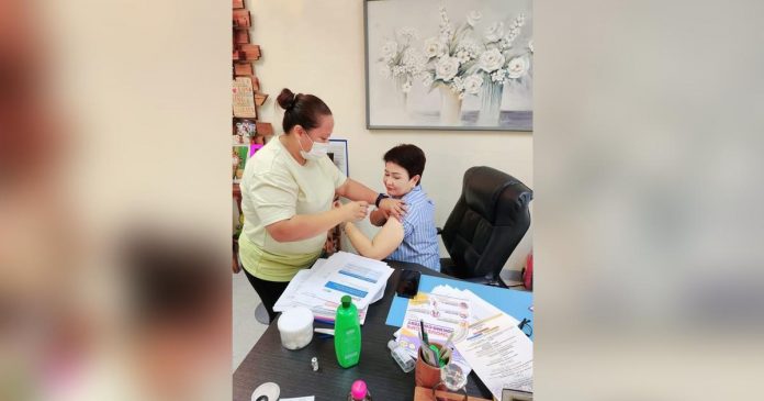 vax_superimposed Dr. Maria Socorro Colmenares-Quiñon, head of the Iloilo Provincial Health Office (IPHO), receives her shot of the bivalent vaccine administered by an IPHO vaccinator on Friday, July 7. MARIA SOCORRO COLMENARES-QUIÑON PHOTO