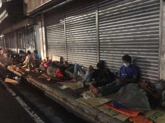 waiting_area_resized Patient watchers sleep on cardboards outside the Corazon Locsin Montelibano Memorial Regional Hospital in Bacolod City, Negros Occidental. AKSYON RADYO BACOLOD PHOTO