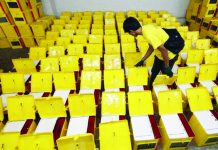 Extended terms raise bar for barangay, SK officials; Treñas: Longer tenure must translate into better service, more programs Commission on Elections (Comelec) Region 6 director Dennis Ausan (inset) says they are expecting this week the arrival of ballot boxes for the Barangay and Sangguniang Kabataan Elections. File photo shows a Comelec personnel inspecting ballot boxes in Metro Manila. ABS-CBN NEWS/FILE PHOTO
